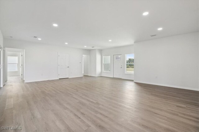 spare room with light hardwood / wood-style flooring