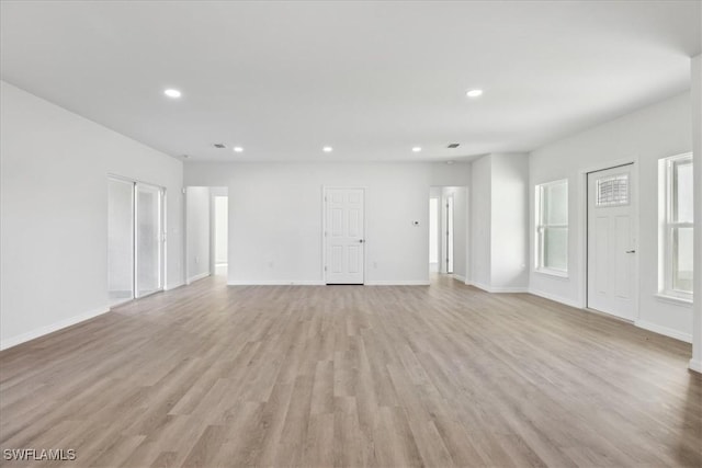 unfurnished living room with light hardwood / wood-style floors