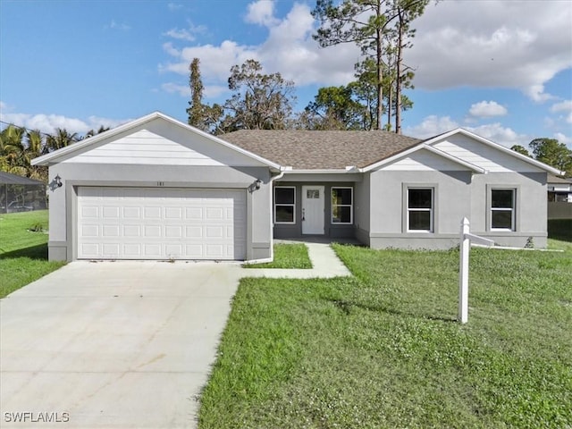 ranch-style home featuring a garage and a front lawn