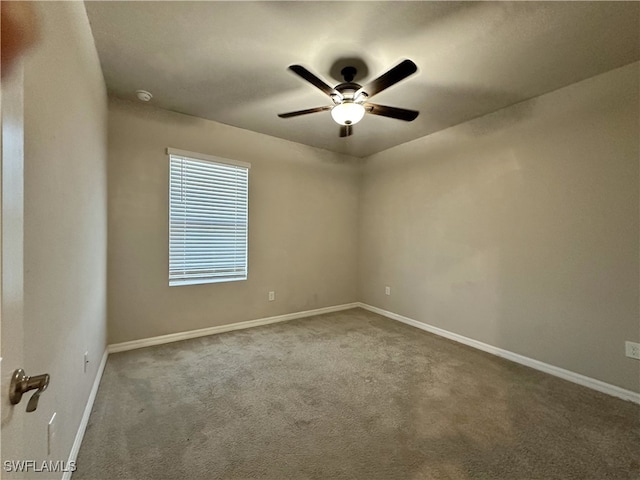 unfurnished room with ceiling fan and carpet floors