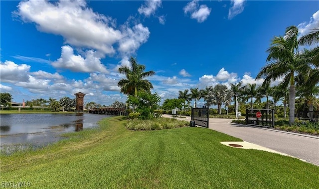 exterior space featuring a water view and a lawn