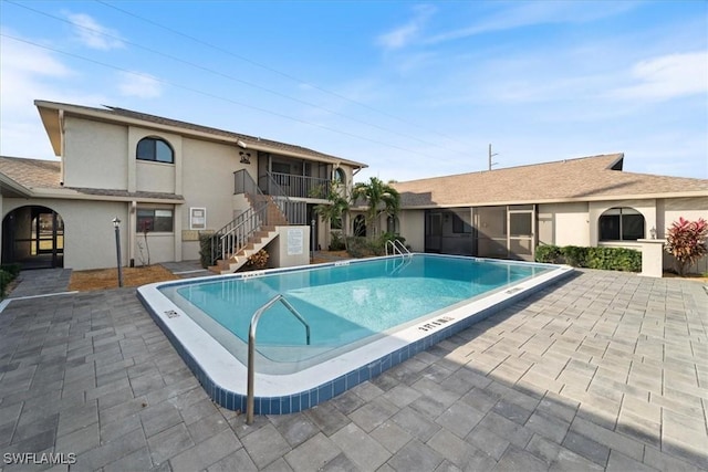 view of pool featuring a patio area