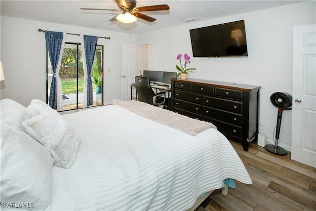 bedroom with wood-type flooring, access to exterior, and ceiling fan