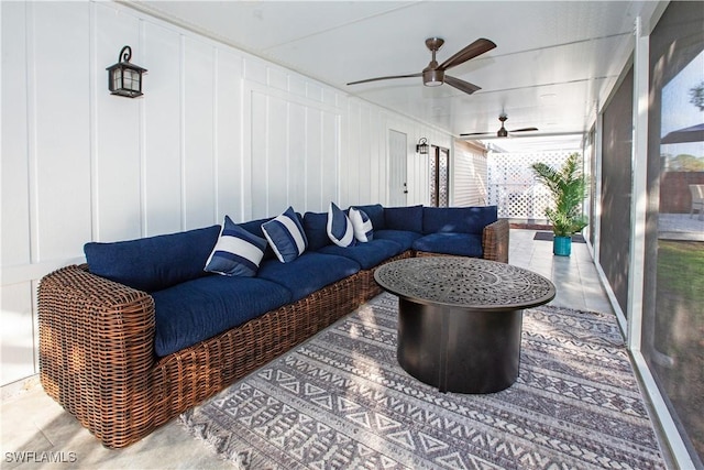 sunroom / solarium with ceiling fan