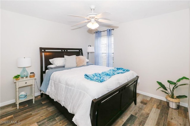 bedroom featuring dark hardwood / wood-style floors and ceiling fan