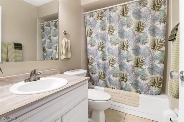 bathroom with toilet, vanity, tile patterned floors, and walk in shower