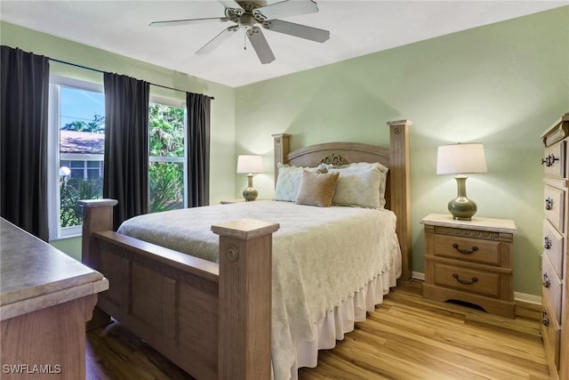 bedroom featuring ceiling fan and light hardwood / wood-style floors