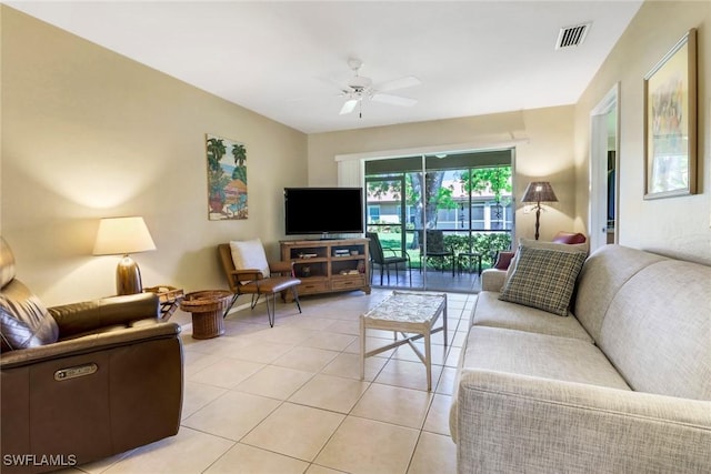 living room with ceiling fan and light tile patterned flooring