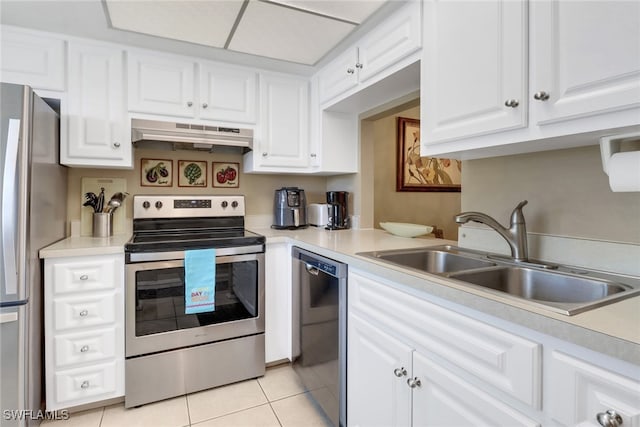 kitchen featuring white cabinets, sink, light tile patterned flooring, stainless steel appliances, and extractor fan