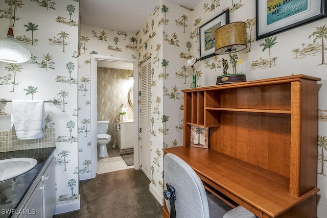 bathroom with tile patterned flooring, vanity, and toilet