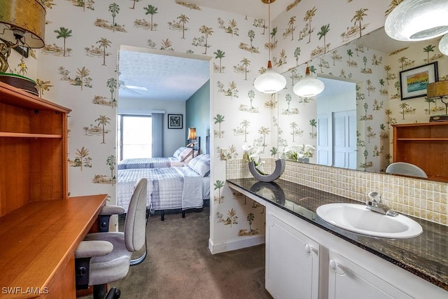 bathroom featuring decorative backsplash and vanity