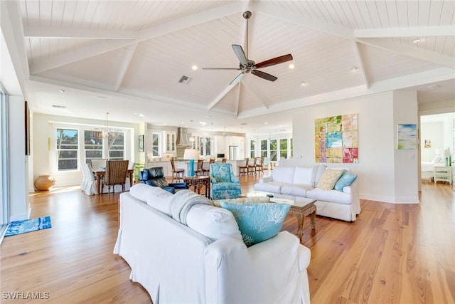 living room with beam ceiling, light hardwood / wood-style flooring, ceiling fan, and wooden ceiling