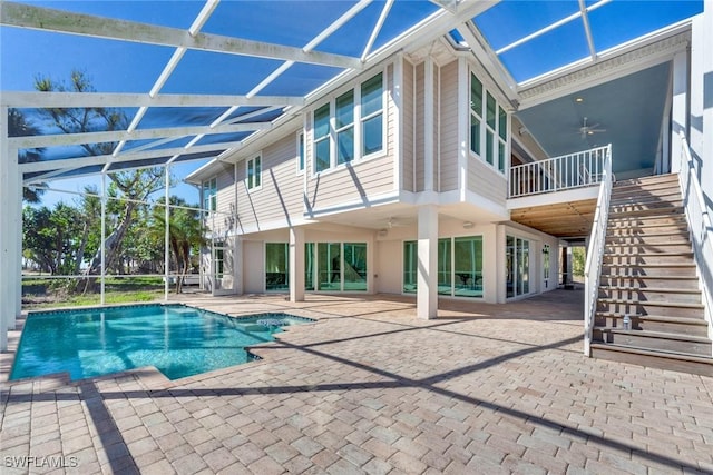 back of house featuring a patio, ceiling fan, and a lanai