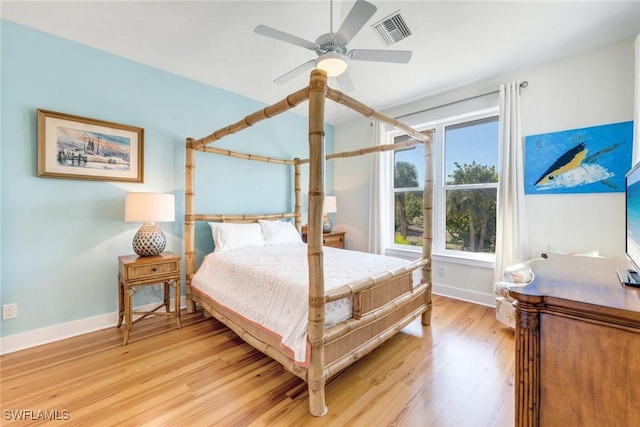 bedroom with ceiling fan and light wood-type flooring