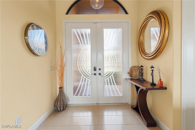 2108 SW 38th Ter, Cape Coral, FL 33914 - foyer entrance featuring french doors, tile patterned flooring, and baseboards