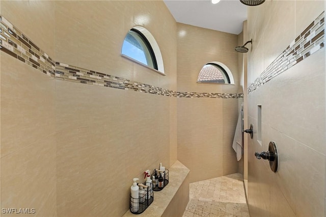 bathroom with a tile shower