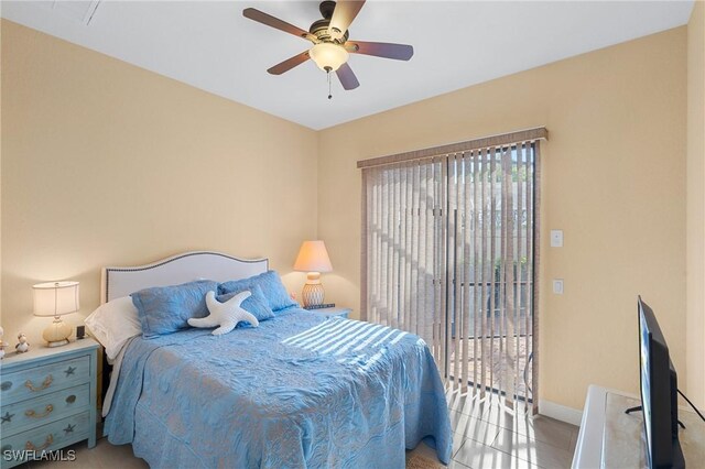 bedroom featuring light tile patterned flooring, access to exterior, and ceiling fan