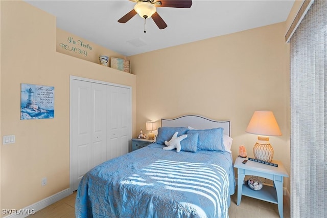 2108 SW 38th Ter, Cape Coral, FL 33914 - tiled bedroom featuring a closet, baseboards, and ceiling fan