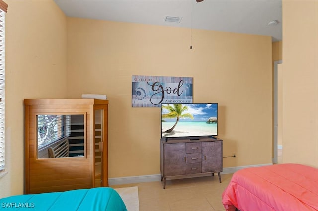 bedroom featuring light tile patterned flooring