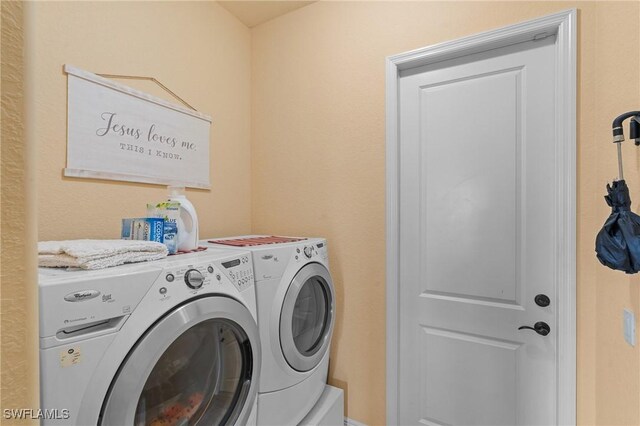 clothes washing area with independent washer and dryer