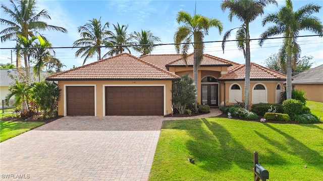 2108 SW 38th Ter, Cape Coral, FL 33914 - mediterranean / spanish-style home with stucco siding, an attached garage, driveway, and a front yard