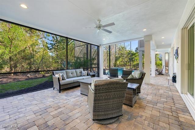 sunroom with ceiling fan