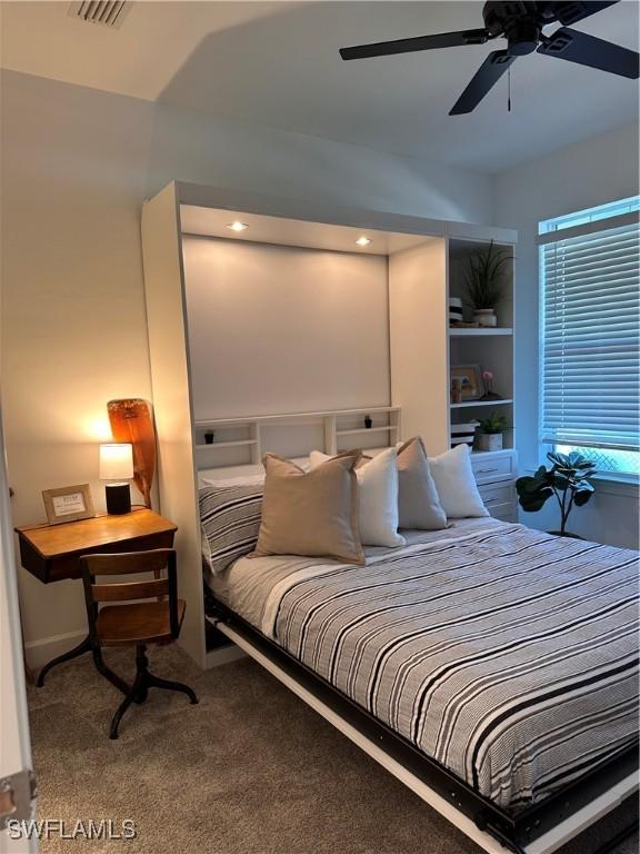 bedroom featuring ceiling fan and carpet floors