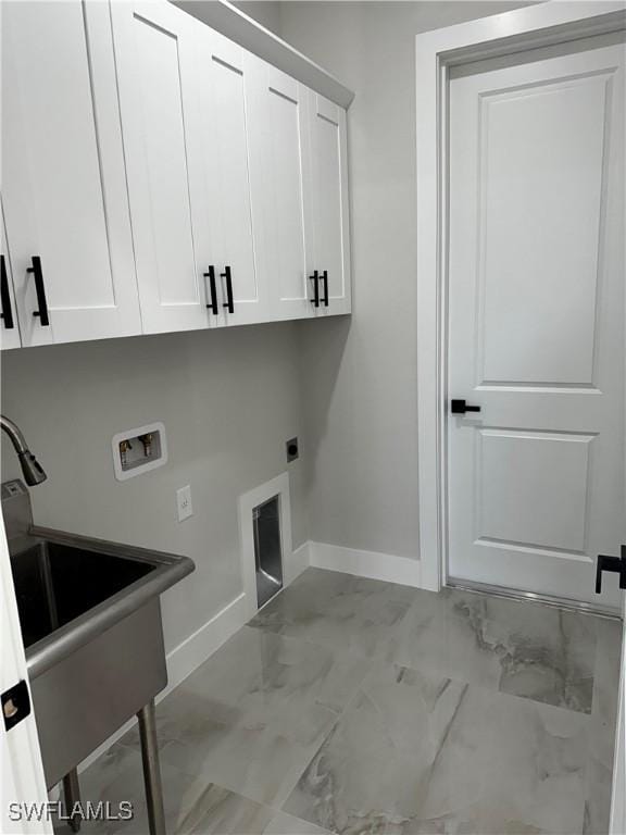 laundry area with cabinets, hookup for a washing machine, and electric dryer hookup