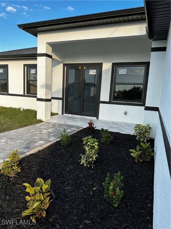 doorway to property featuring french doors