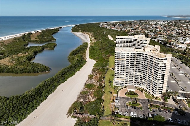 birds eye view of property featuring a water view and a view of the beach