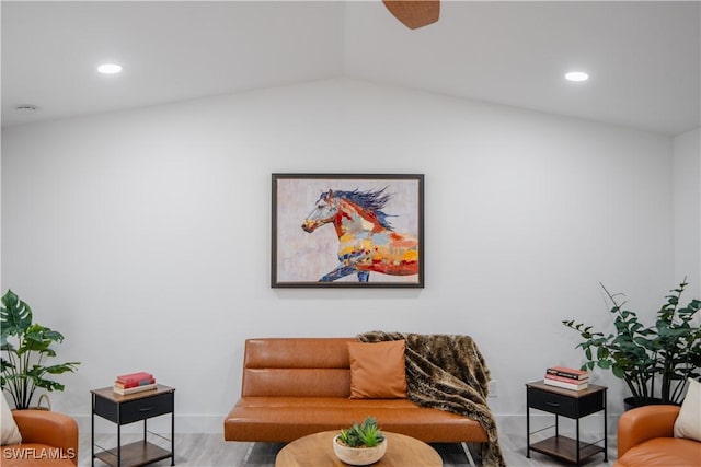 living room featuring hardwood / wood-style floors and lofted ceiling