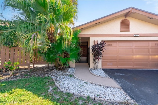 view of front of property featuring a garage