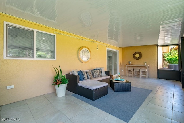 view of patio / terrace featuring outdoor lounge area and an outdoor bar