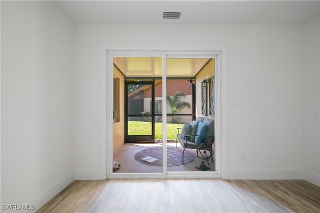 doorway featuring hardwood / wood-style flooring