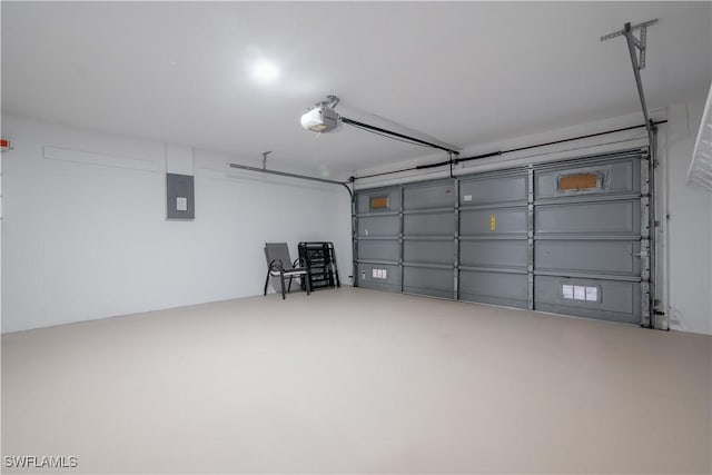 garage with electric panel and a garage door opener