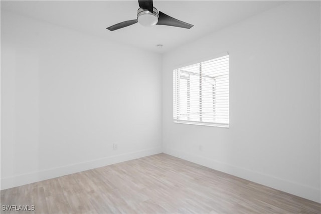 unfurnished room with ceiling fan and light wood-type flooring