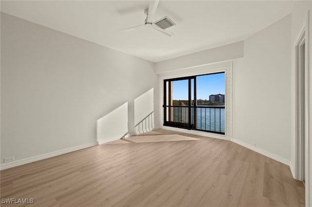 unfurnished living room with light hardwood / wood-style floors and ceiling fan