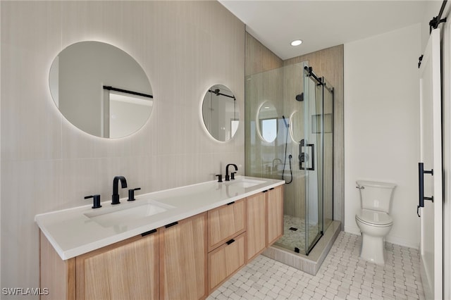 bathroom featuring tile patterned flooring, vanity, toilet, and a shower with shower door