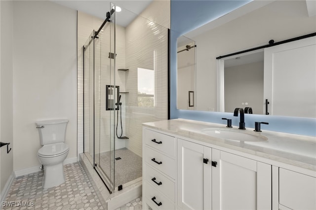 bathroom featuring tile patterned floors, vanity, an enclosed shower, and toilet