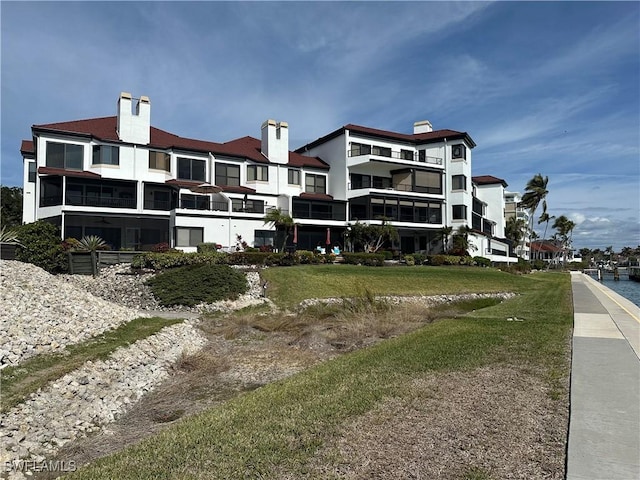 view of building exterior featuring a water view