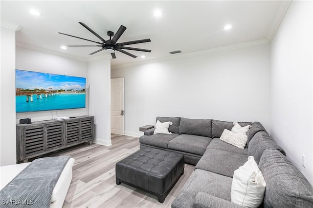 living room featuring crown molding, light hardwood / wood-style flooring, and ceiling fan