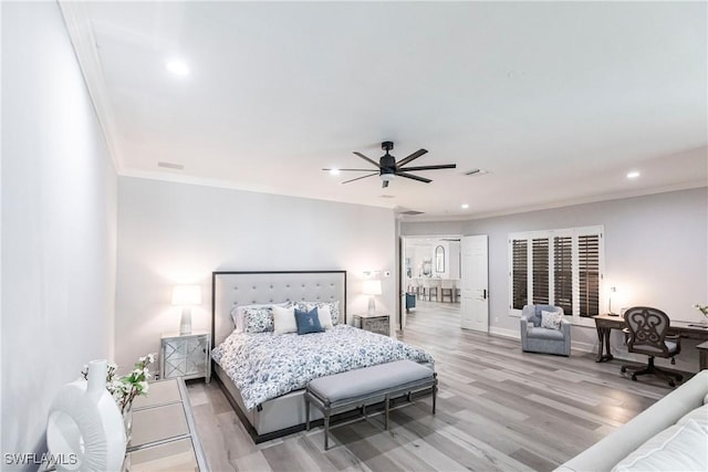 bedroom with light wood-type flooring, ceiling fan, and crown molding