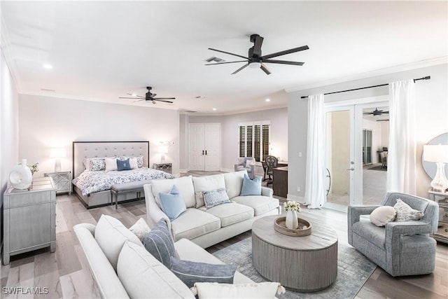 bedroom with hardwood / wood-style flooring, ceiling fan, and crown molding