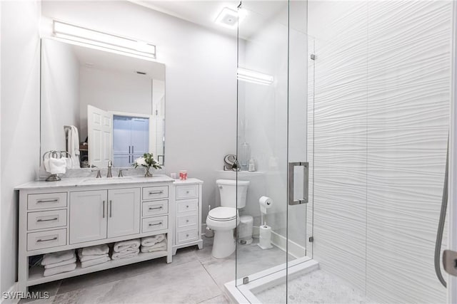 bathroom with vanity, an enclosed shower, and toilet