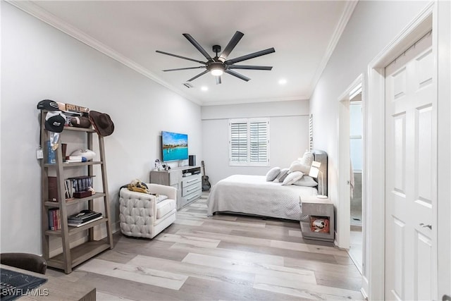 bedroom with ceiling fan, crown molding, and light hardwood / wood-style flooring