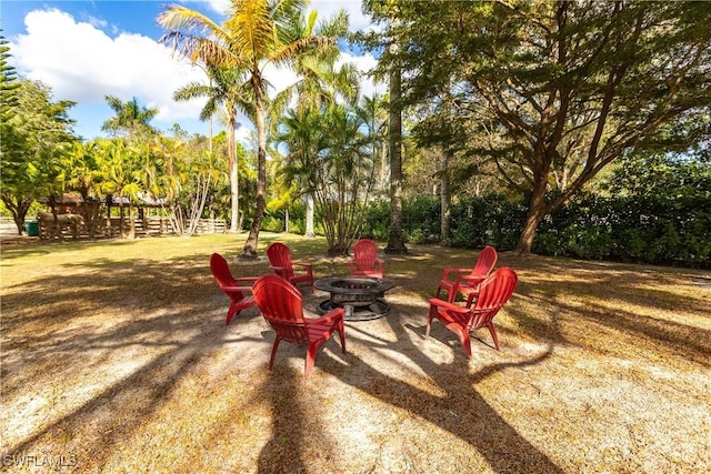 view of yard with an outdoor fire pit