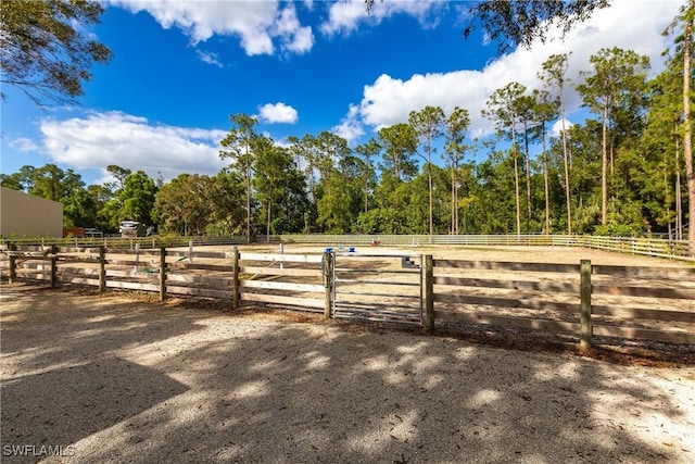 view of yard with a rural view