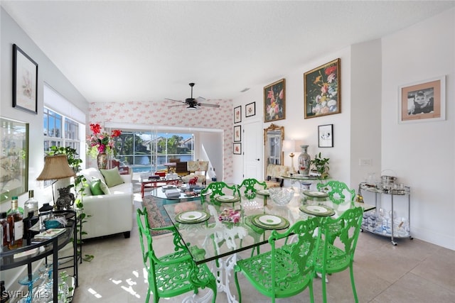 dining space with a wealth of natural light and ceiling fan