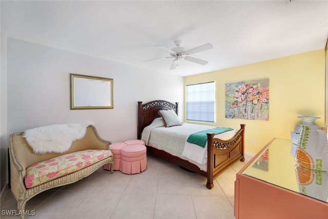 tiled bedroom featuring ceiling fan