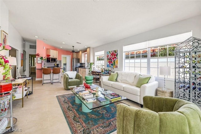 living room featuring ceiling fan